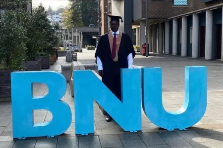 Minawi Receives Bachelor’s Degree from Buckinghamshire New University