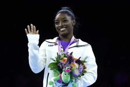 Biles wins beam and floor golds to reach 23 world titles