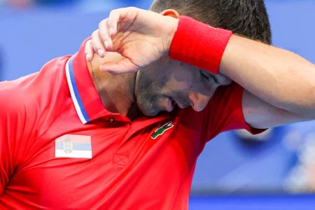 Djokovic wrist injury dooms Serbia as Poland power past China