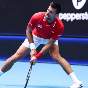 Injury worries for Djokovic, Tsitsipas as Serbia squeeze into quarters