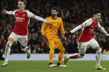 Alisson blunder helps Arsenal rock Liverpool as title race ignites