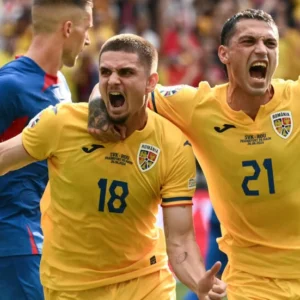 Romania and Slovakia reach last 16 at Euro 2024 after tense draw