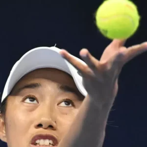 Defiant history-maker Zhang Shuai powers into Beijing last eight