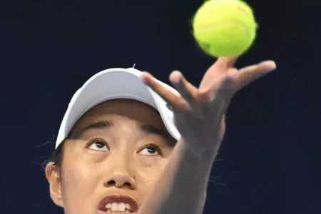 Defiant history-maker Zhang Shuai powers into Beijing last eight