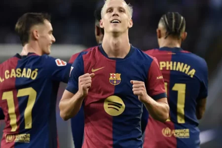 Olmo double helps Liga leaders Barca to derby win over Espanyol